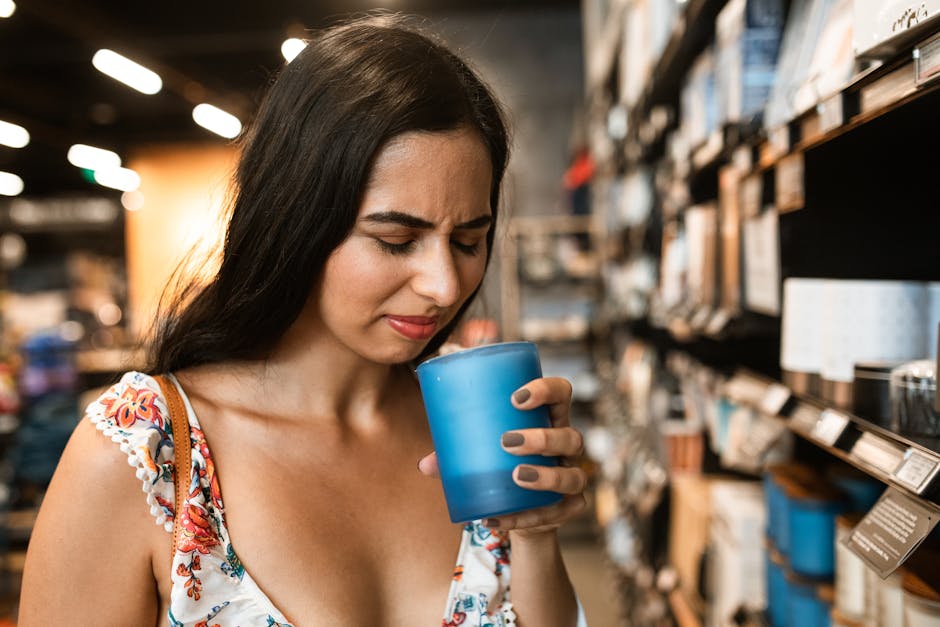 A young woman in a floral dress experiences an unpleasant scent while shopping.